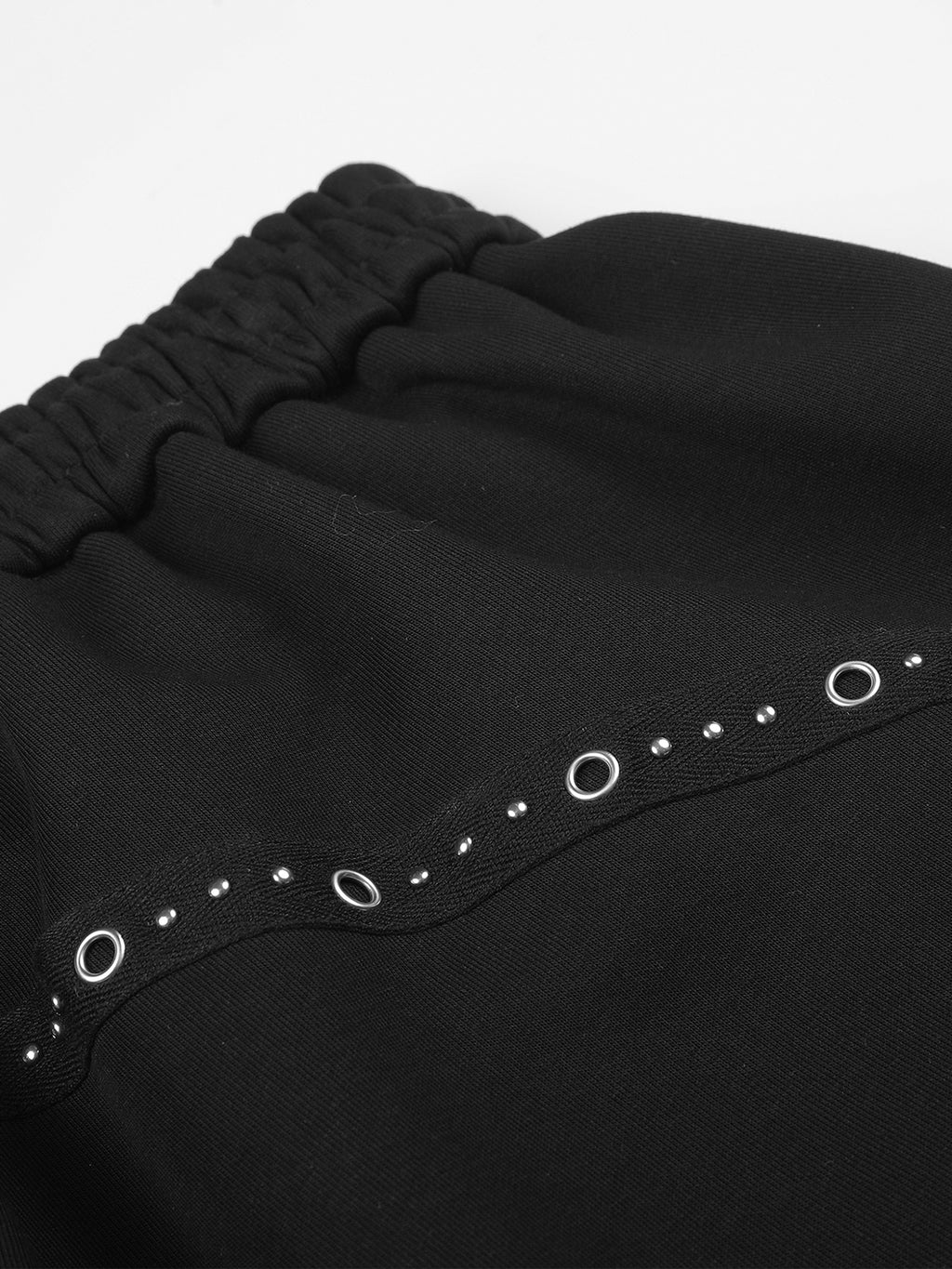 Eyelet-Studded Paneled Baggy Sweatpants
